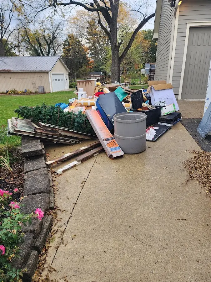 Dumpster being loaded with debris for Residential Dumpster Rental in Kimball